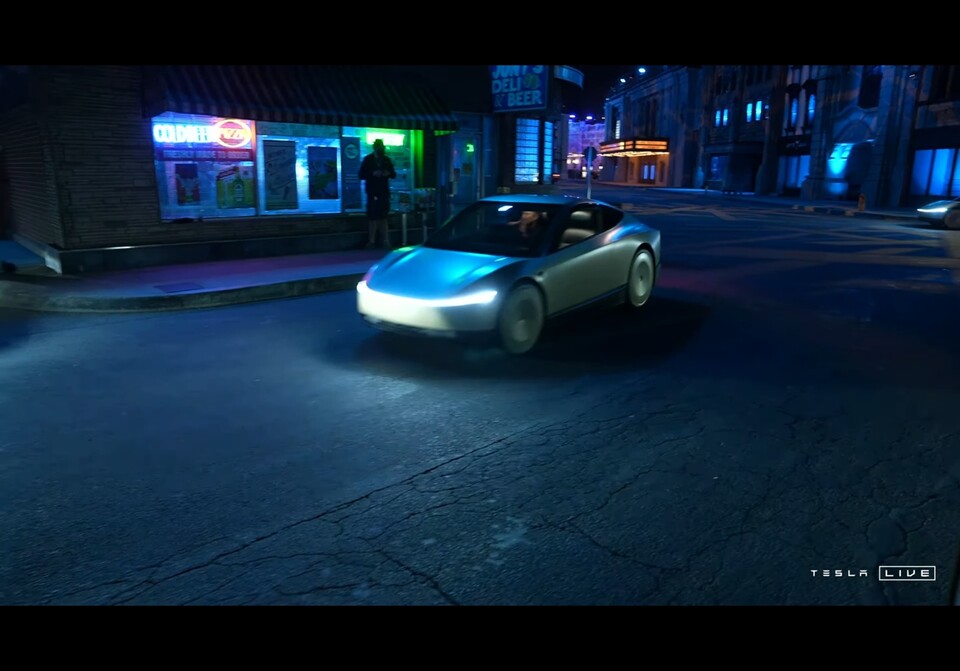 테슬라 로보택시 '사이버캡'이 일론 머스크 테슬라 CEO를 태운 채 미국 로스엔젤레스 워너브러더스스튜디오를 통과하고 있다. /사진=테슬라 유튜브 라이브 방송 캡처